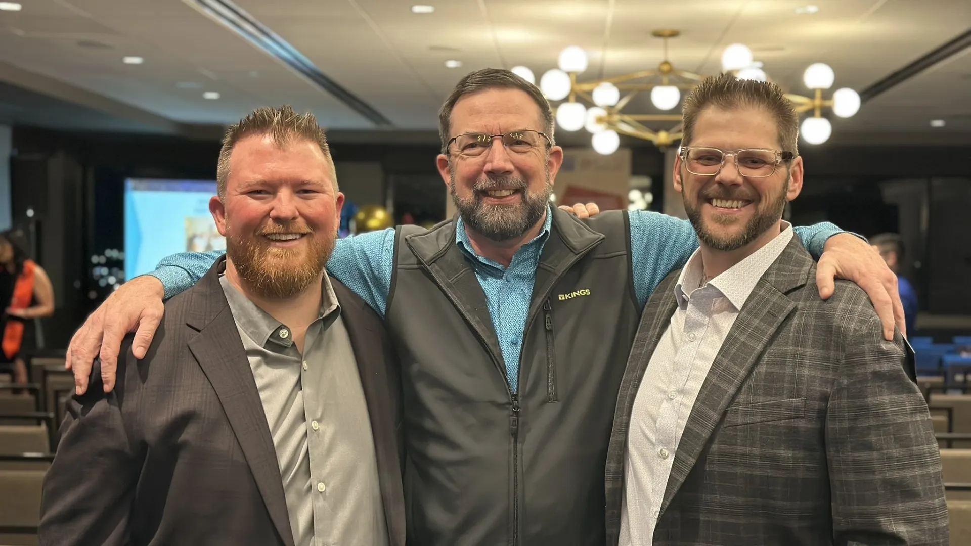 Brandon Wolf with Andy Markus and Mike Evans